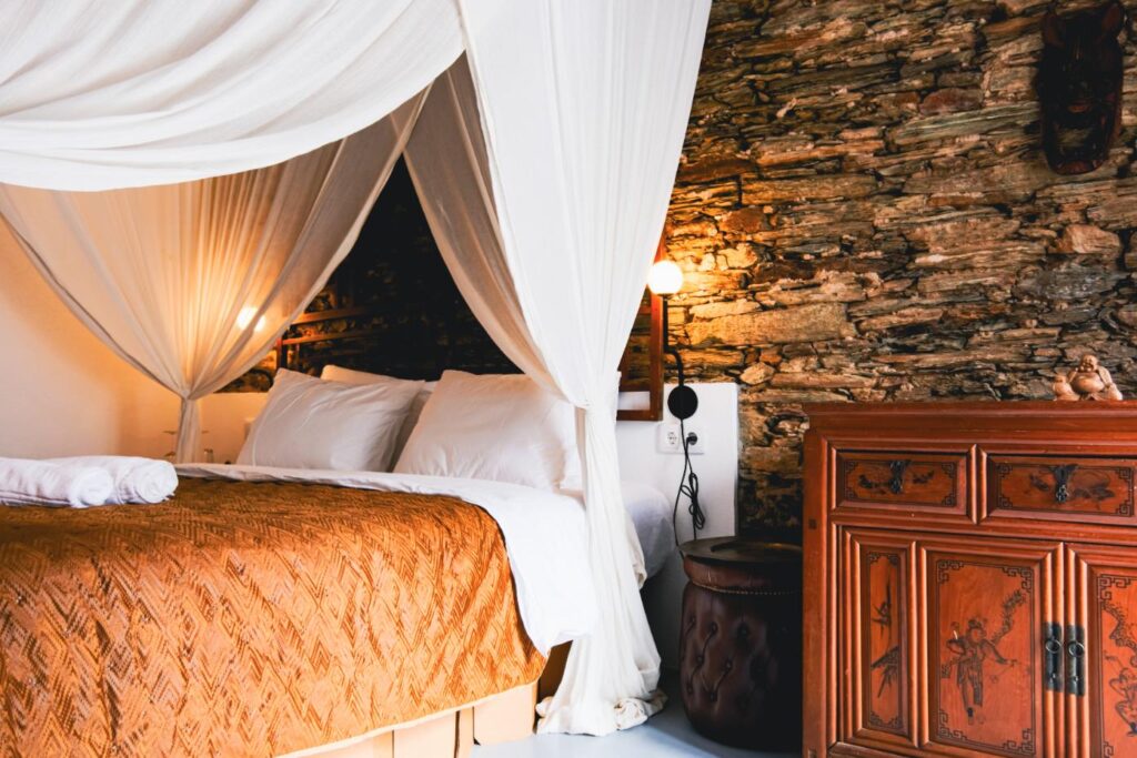 Asian Room 2 – A serene retreat at Eco Resort Portugal, inspired by Hong Kong and Bali with curated Asian furniture and a tranquil altar.