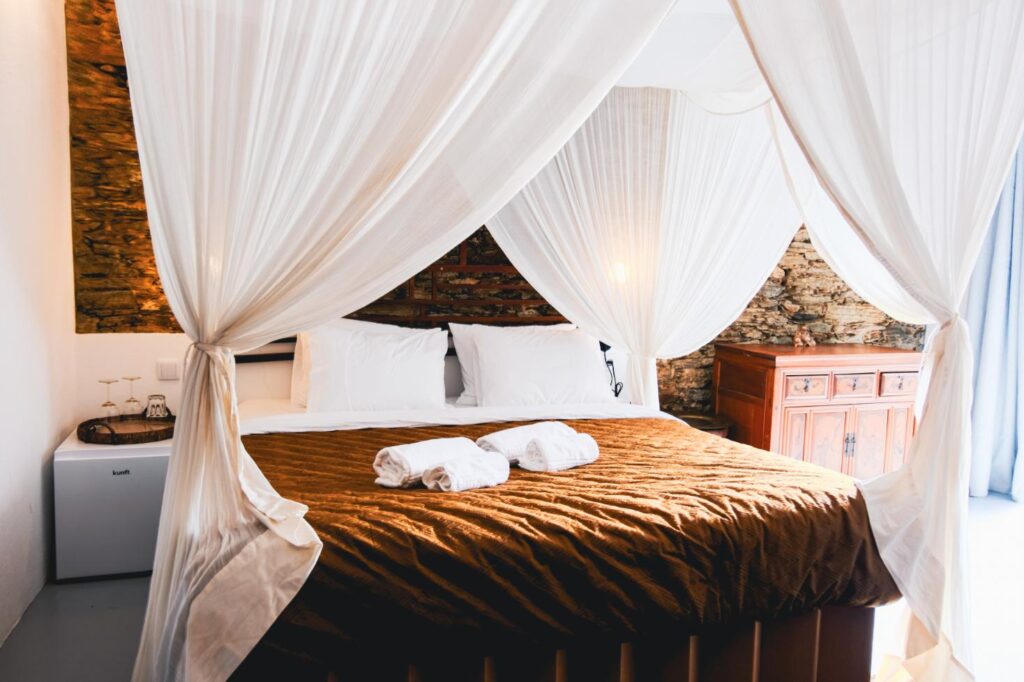 Asian Room 6 โ A serene retreat at Eco Resort Portugal, inspired by Hong Kong and Bali with curated Asian furniture and a tranquil altar.