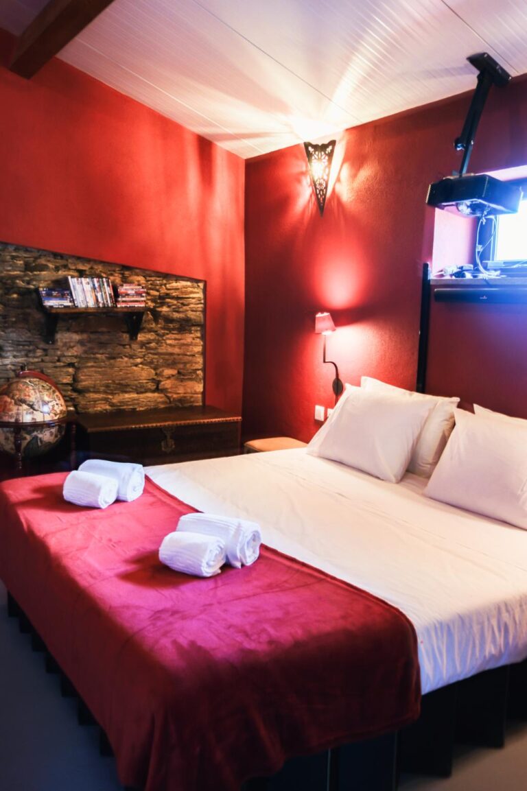 The Cinema Room 1 – A cozy cinematic space at Eco Resort Portugal with projector, screen, and curated film selection.