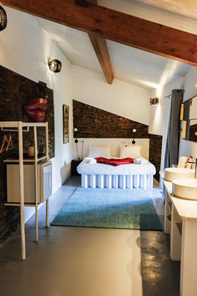 The Loverโs Room 2 โ A romantic apartment at Eco Resort Portugal with an elevated bed, bathtub, mirrors, and private terrace.